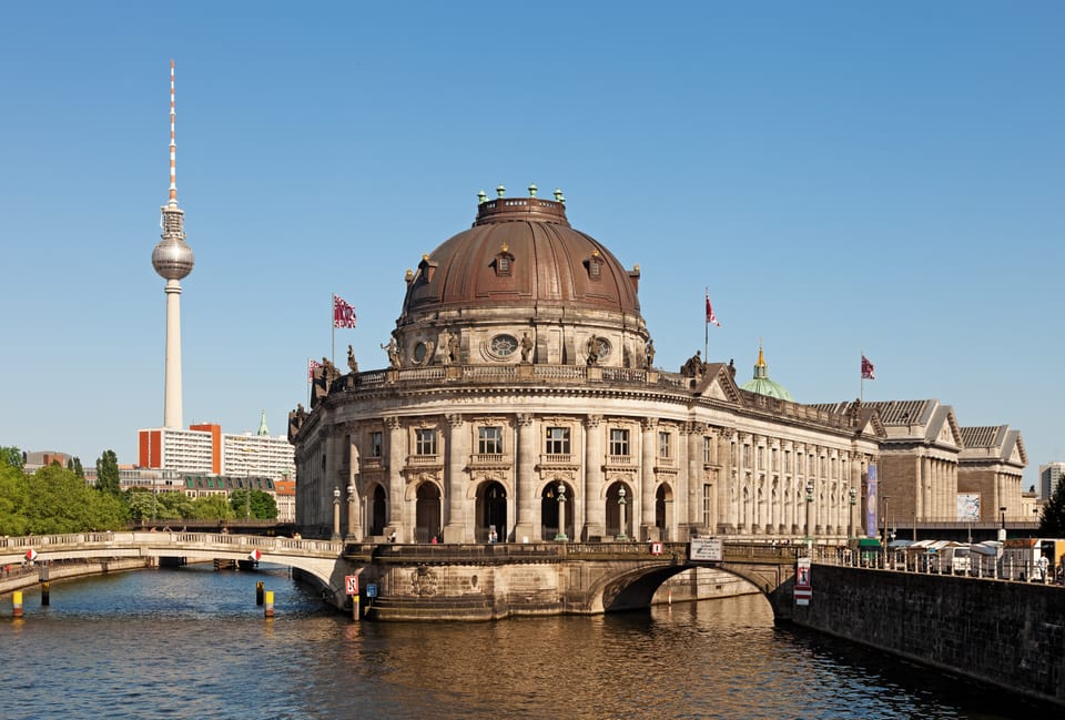 Museum Island buildings with the Berlin TV Tower in the background.
